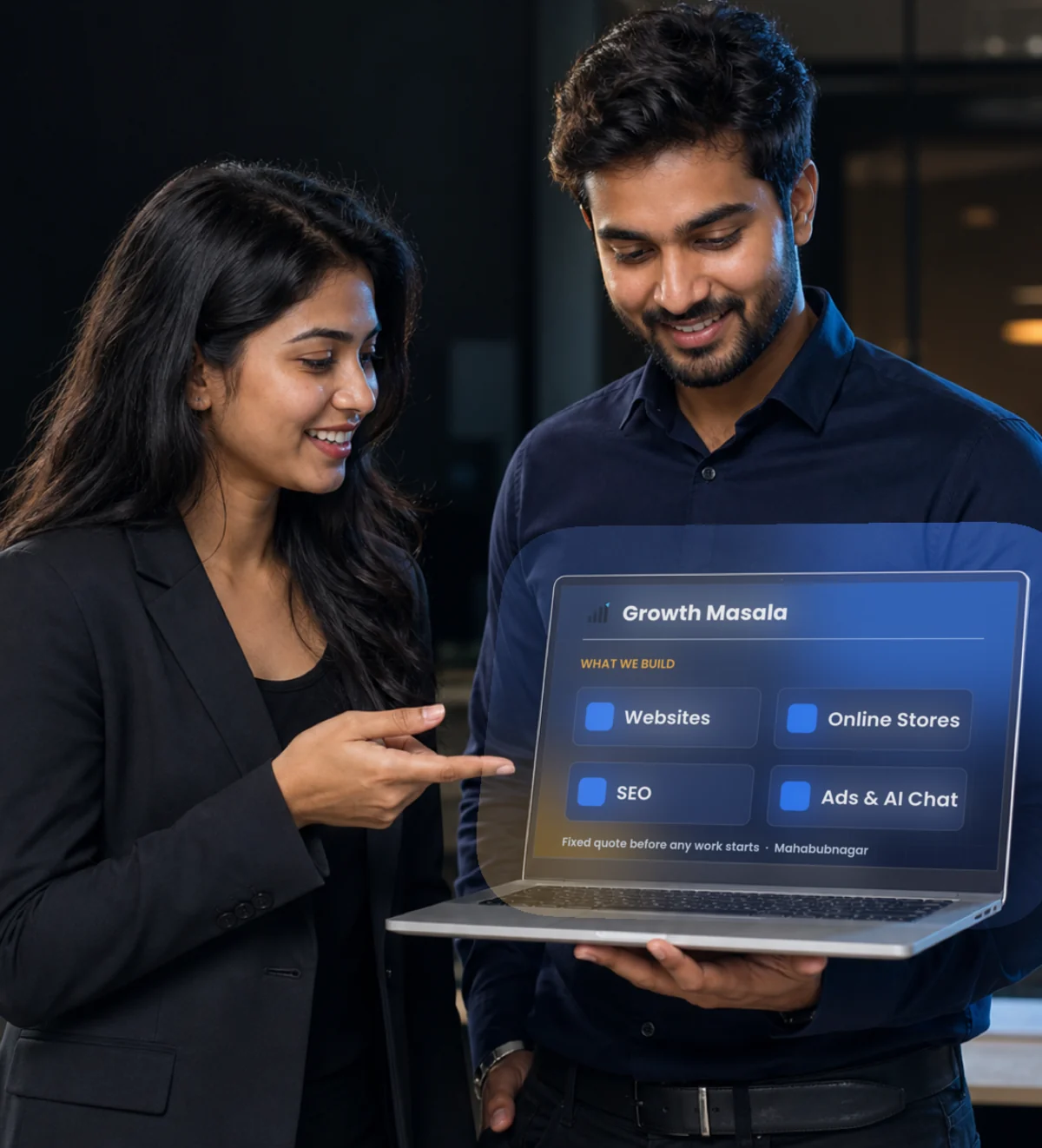 Two people reviewing a laptop that lists what we build: websites, online stores, SEO, and ads with AI chat — with a fixed quote before any work starts, from Mahabubnagar